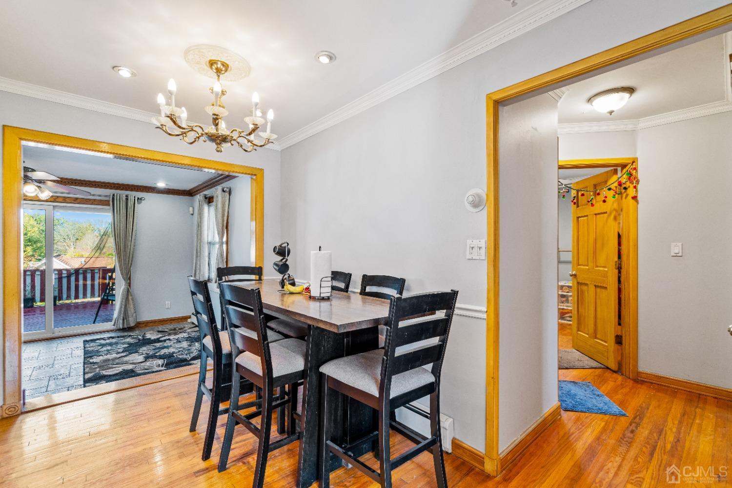 185 Midfield Road Colonia, NJ 07067 - Photo 7 of 27 a view of a dining room with furniture and wooden floor