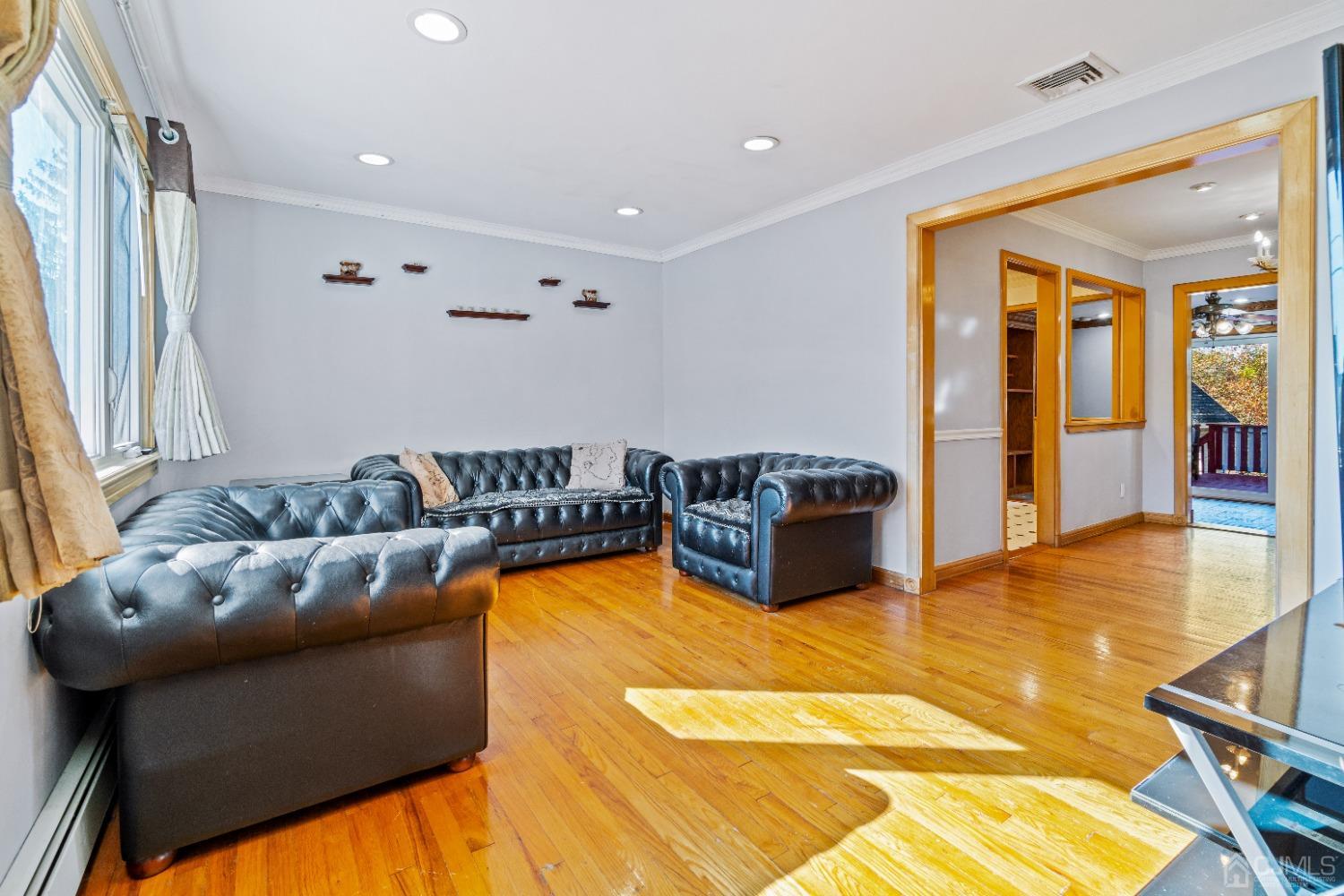 185 Midfield Road Colonia, NJ 07067 - Photo 8 of 27 a living room with furniture and a pool