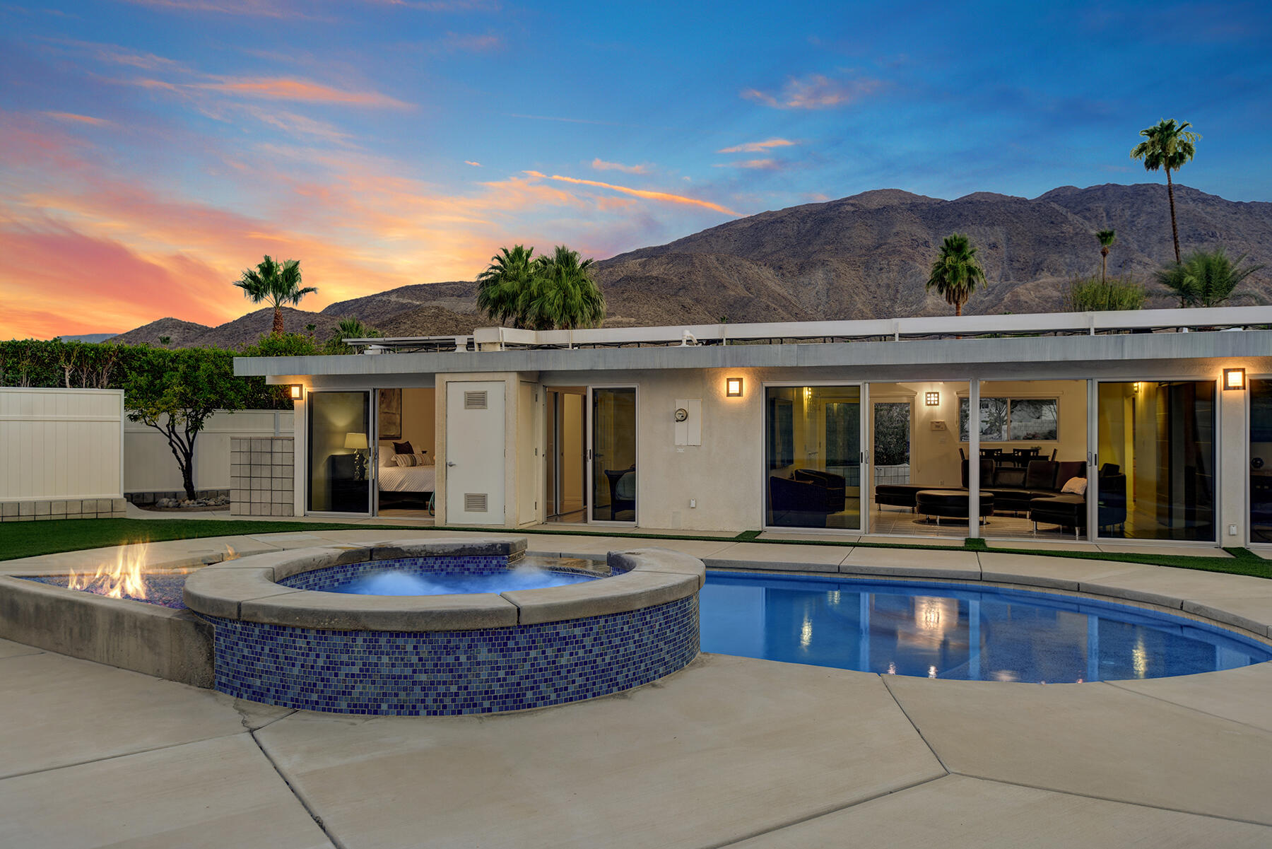 71704 Tunis Road Rancho Mirage, CA 92270 - Photo 1 of 47 a view of a house with swimming pool and porch
