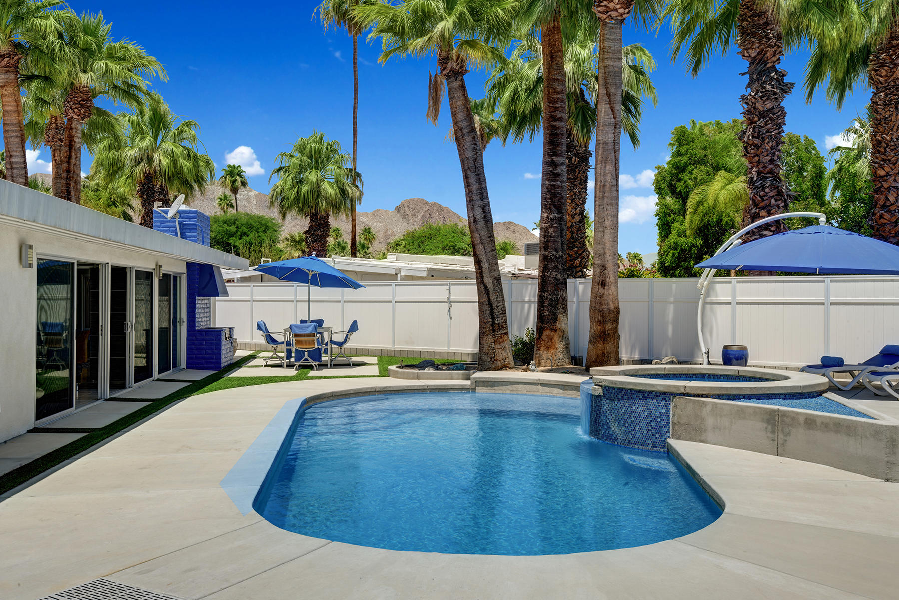 71704 Tunis Road Rancho Mirage, CA 92270 - Photo 11 of 47 a view of a house with swimming pool and sitting area