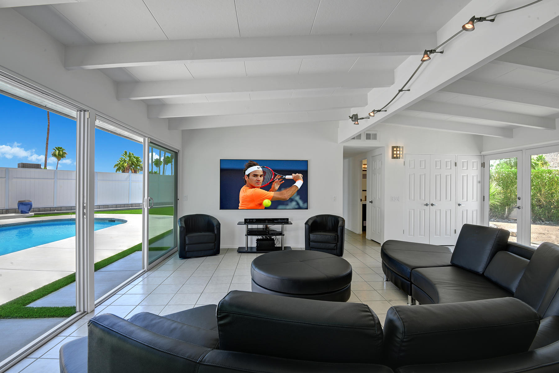 71704 Tunis Road Rancho Mirage, CA 92270 - Photo 12 of 47 a living room with furniture and a flat screen tv