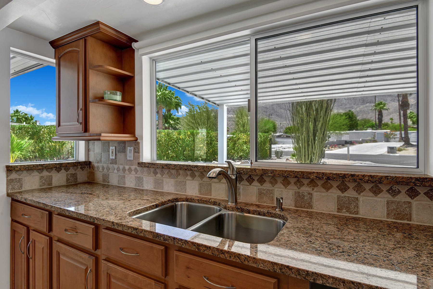 71704 Tunis Road Rancho Mirage, CA 92270 - Photo 13 of 47 a kitchen with a sink and large window