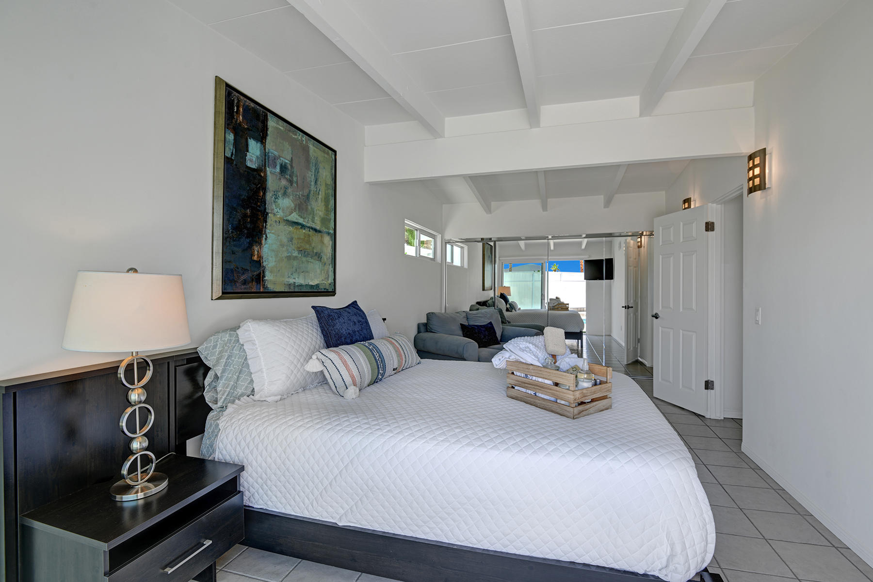 71704 Tunis Road Rancho Mirage, CA 92270 - Photo 18 of 47 a bedroom with a bed a mirror and window