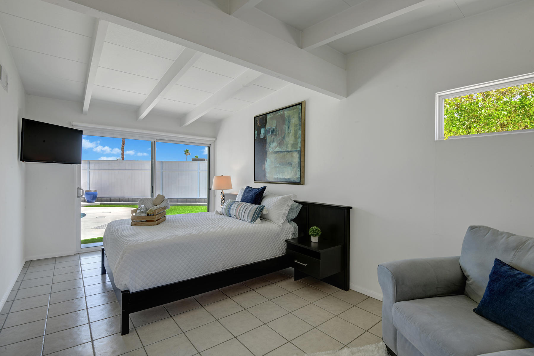 71704 Tunis Road Rancho Mirage, CA 92270 - Photo 19 of 47 a bedroom with a bed and a couch