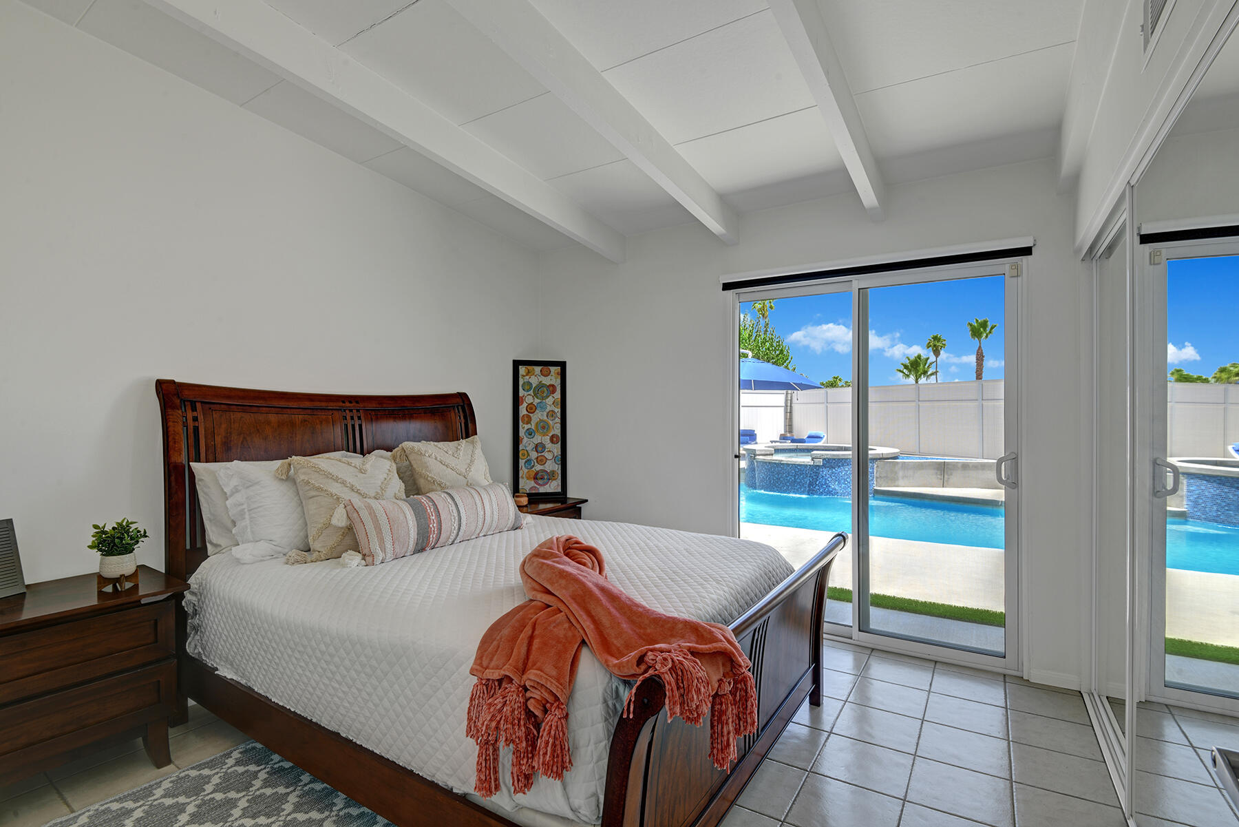 71704 Tunis Road Rancho Mirage, CA 92270 - Photo 23 of 47 a bedroom with a bed and glass door