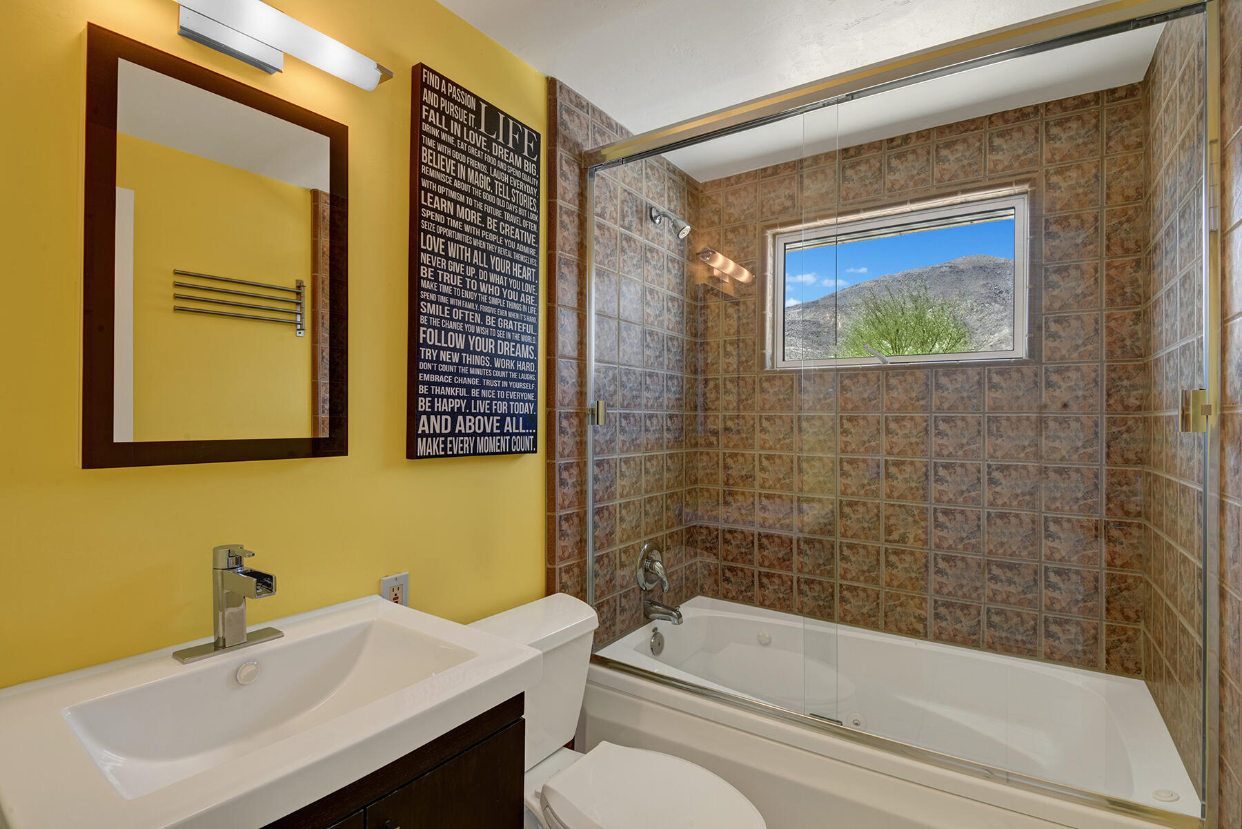 71704 Tunis Road Rancho Mirage, CA 92270 - Photo 25 of 47 a bathroom with a sink mirror toilet and bathtub