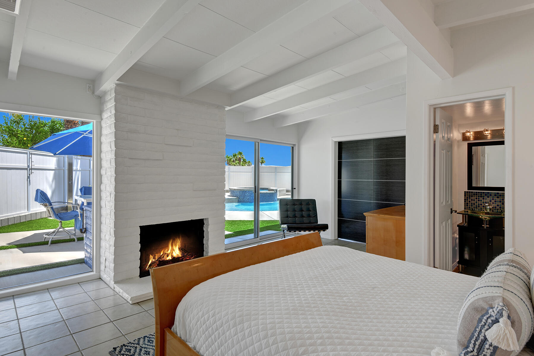 71704 Tunis Road Rancho Mirage, CA 92270 - Photo 27 of 47 a bedroom with a bed and a fireplace