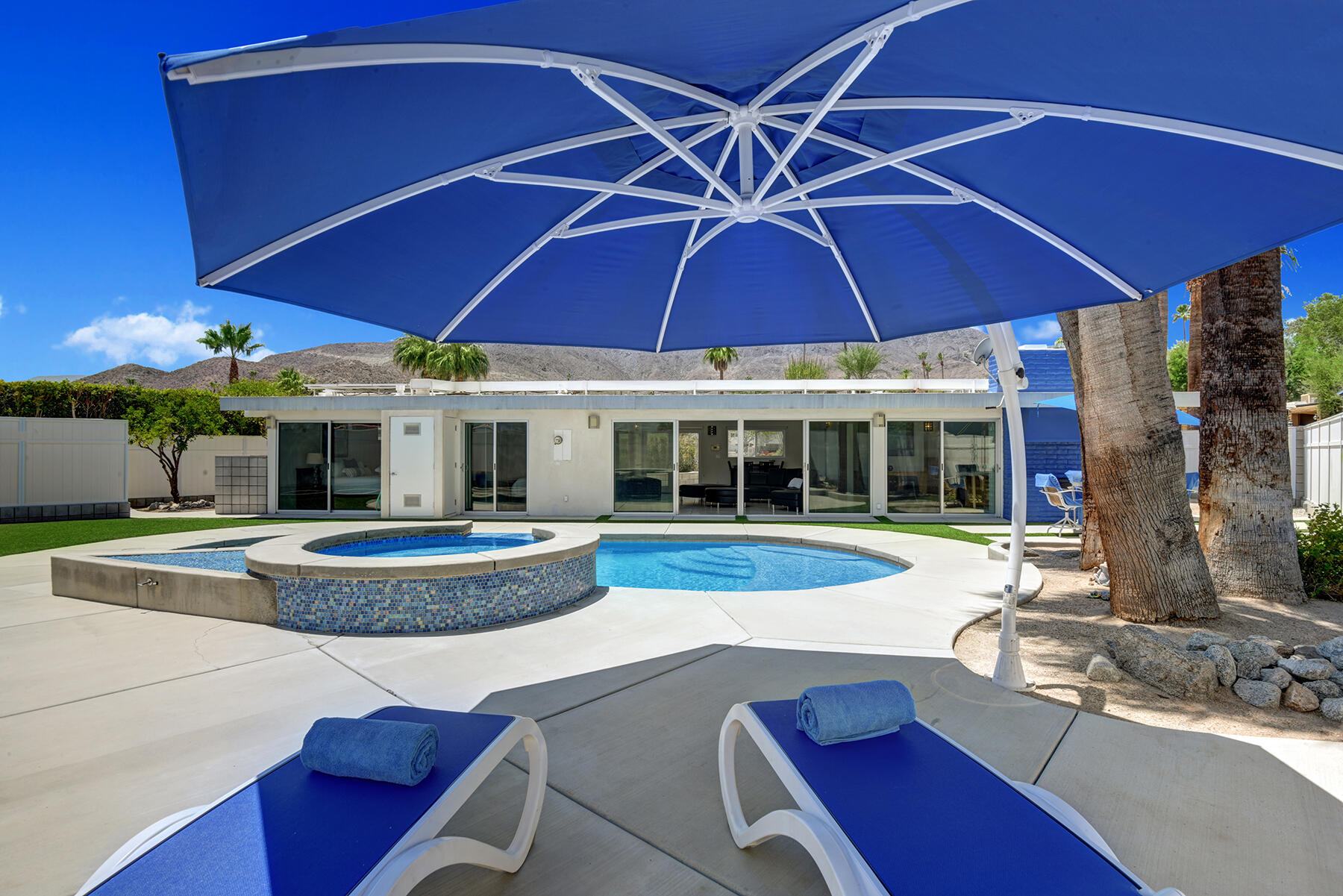 71704 Tunis Road Rancho Mirage, CA 92270 - Photo 31 of 47 a view of a house with swimming pool and sitting area