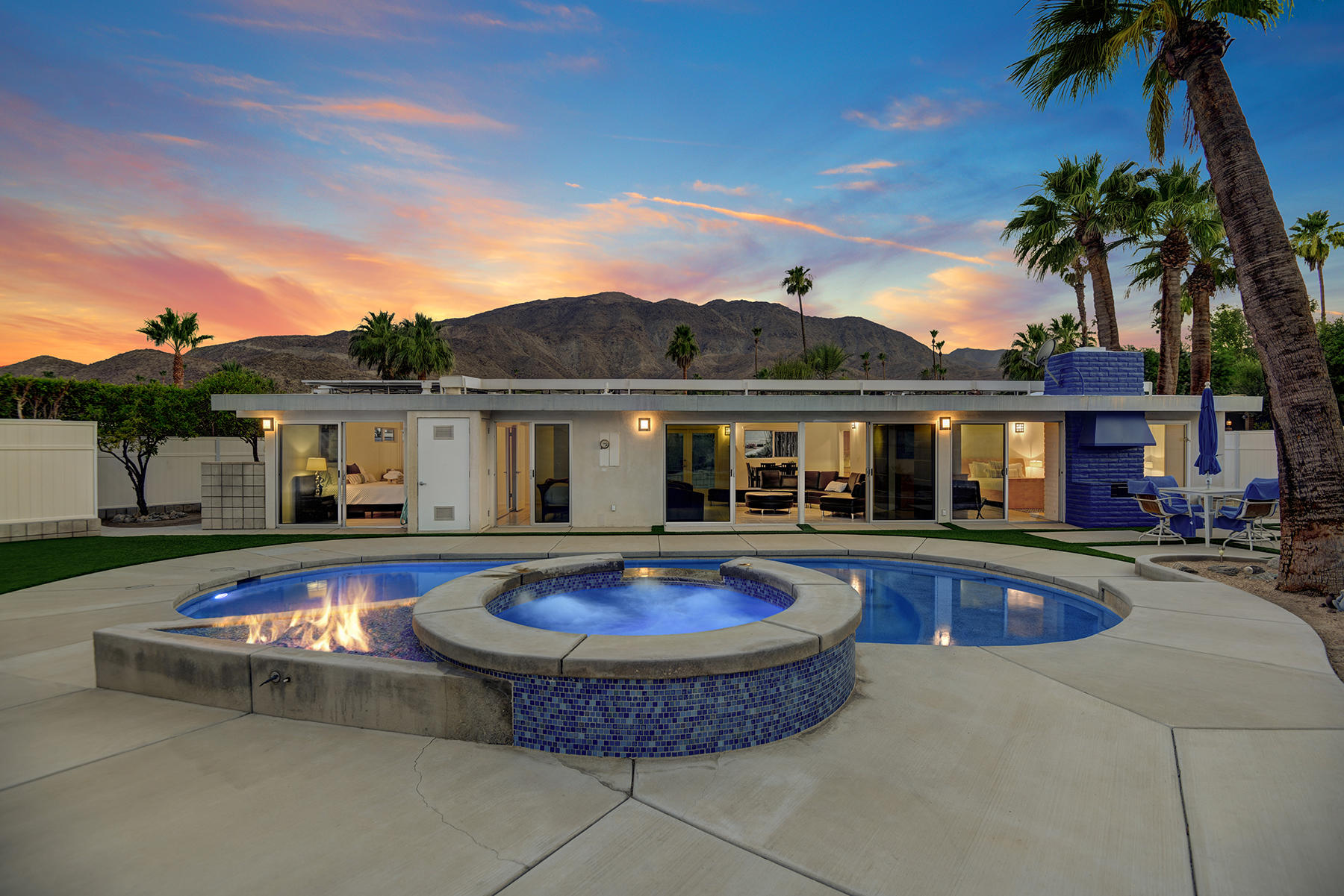 71704 Tunis Road Rancho Mirage, CA 92270 - Photo 37 of 47 a front view of house with swimming pool and a yard