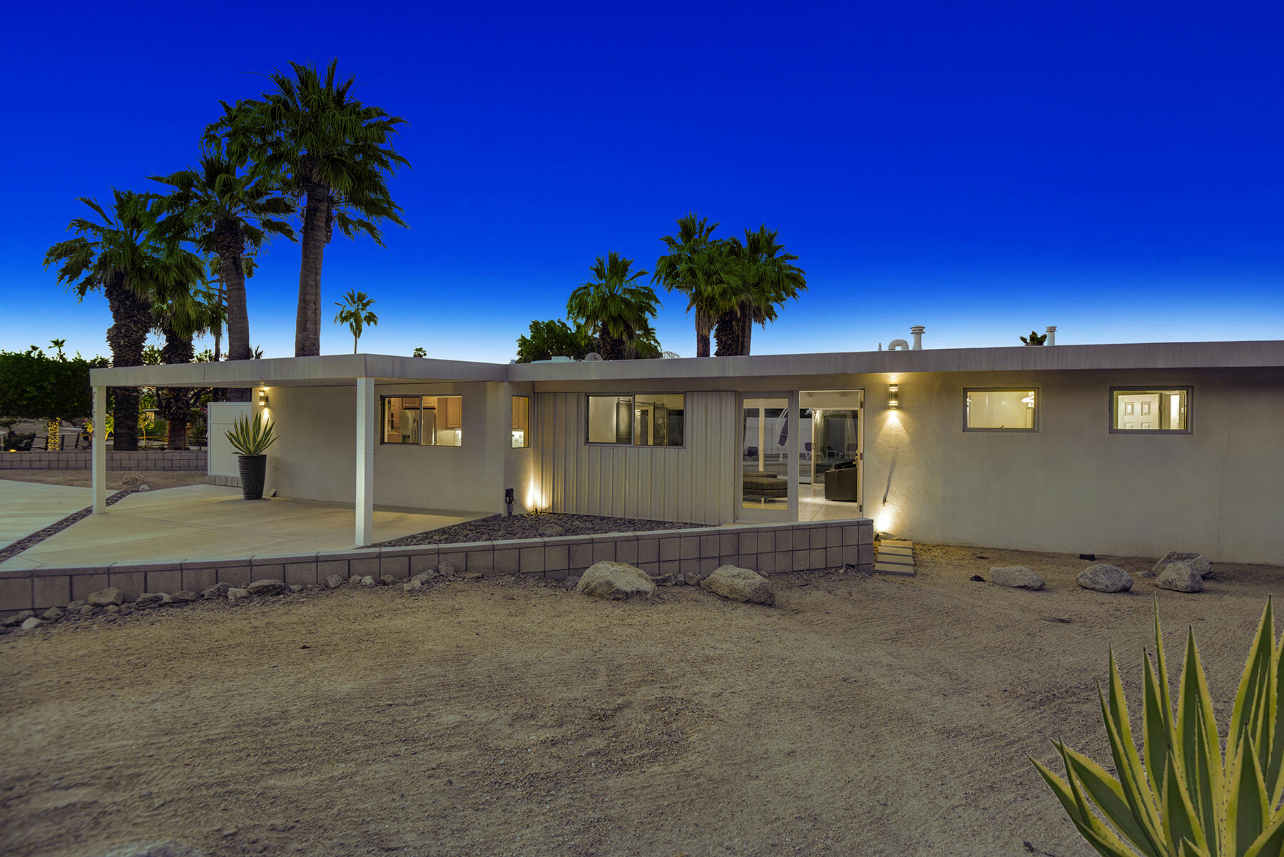 71704 Tunis Road Rancho Mirage, CA 92270 - Photo 38 of 47 a front view of a house with a yard