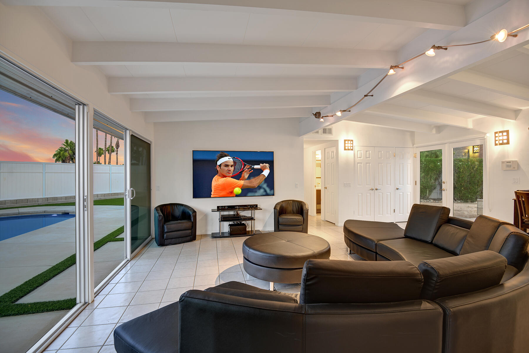 71704 Tunis Road Rancho Mirage, CA 92270 - Photo 40 of 47 a living room with furniture and a flat screen tv