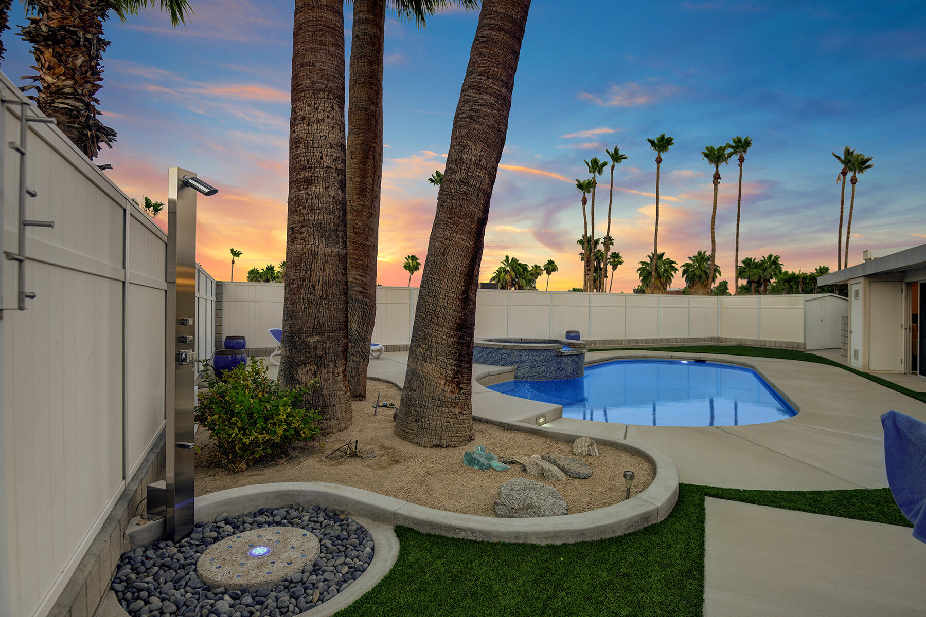 71704 Tunis Road Rancho Mirage, CA 92270 - Photo 41 of 47 a swimming pool with barbeque outdoor seating and yard in back