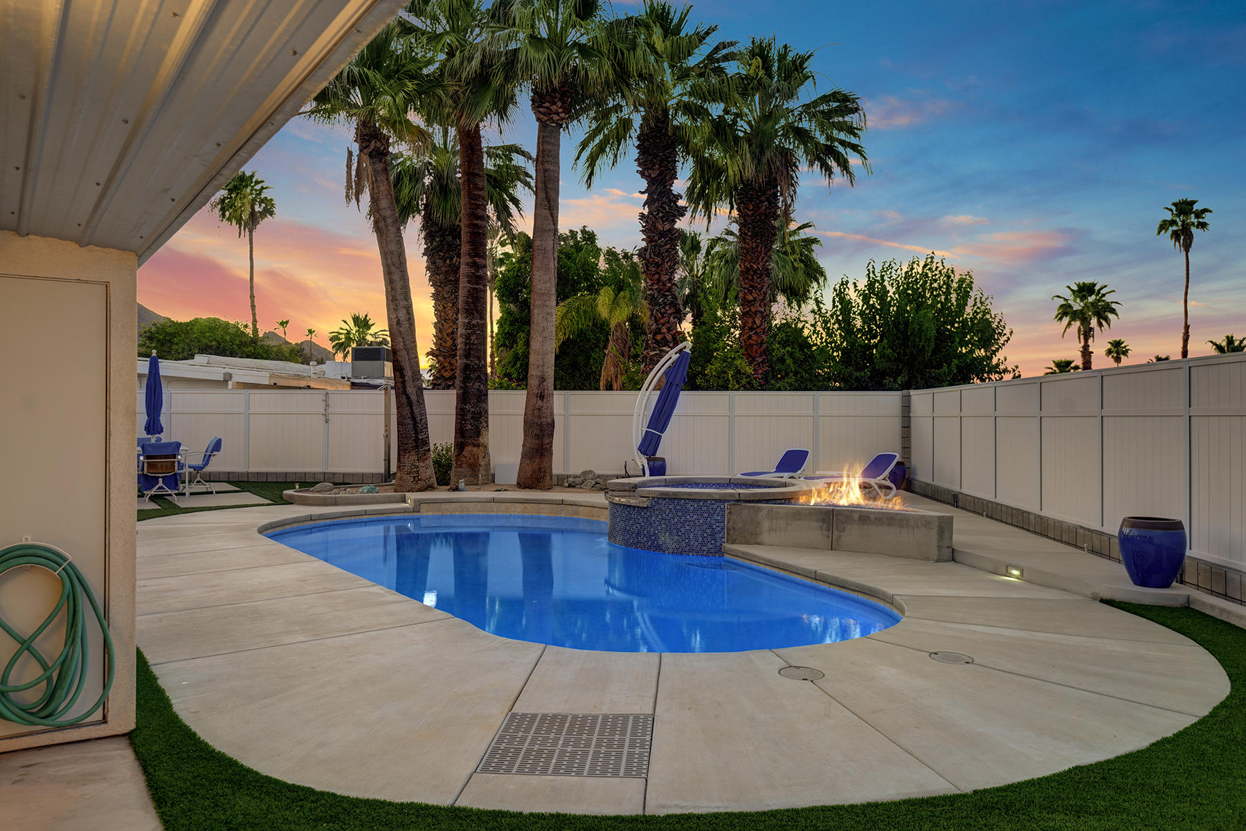 71704 Tunis Road Rancho Mirage, CA 92270 - Photo 44 of 47 a view of a swimming pool with a patio and a yard