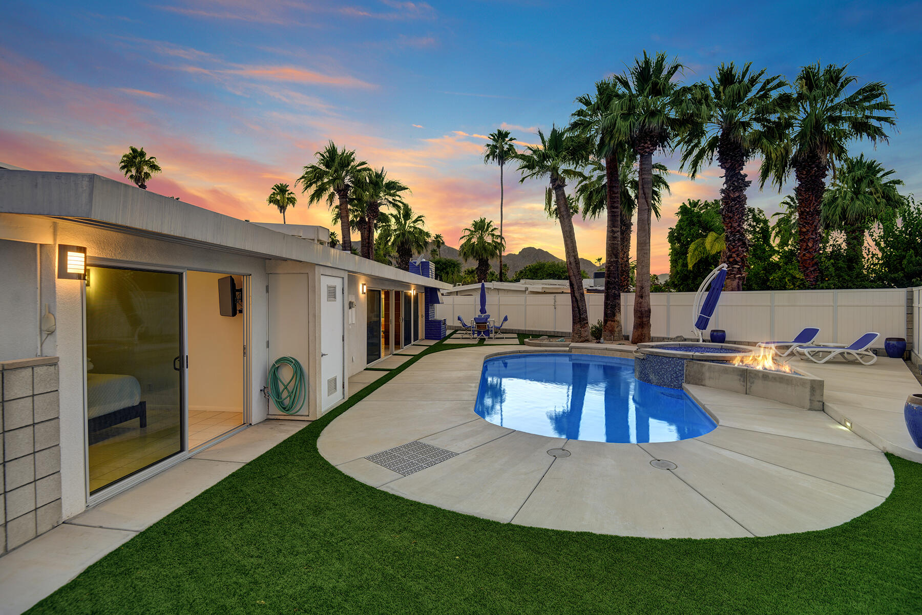 71704 Tunis Road Rancho Mirage, CA 92270 - Photo 45 of 47 a view of a house with swimming pool and a yard