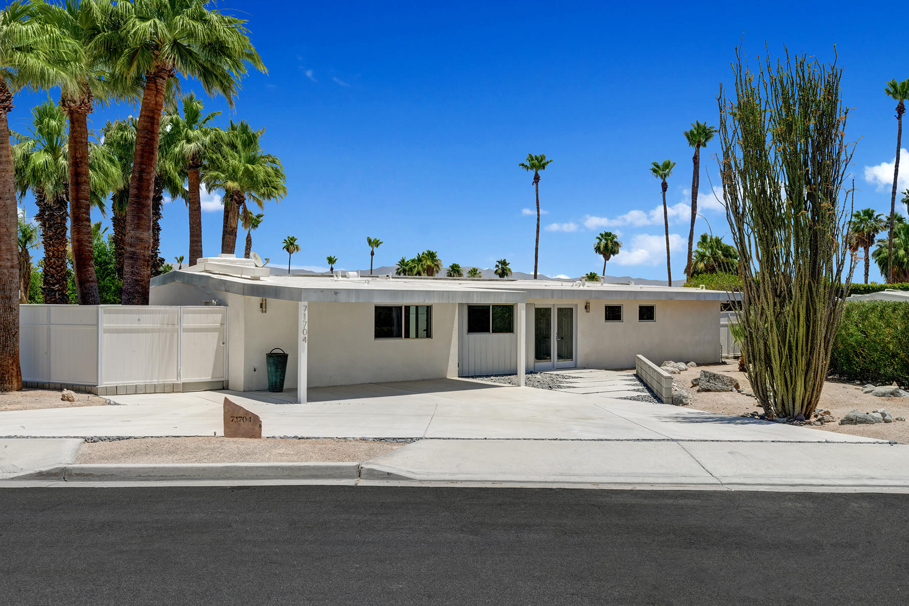 71704 Tunis Road Rancho Mirage, CA 92270 - Photo 47 of 47 a view of a white house with palm trees