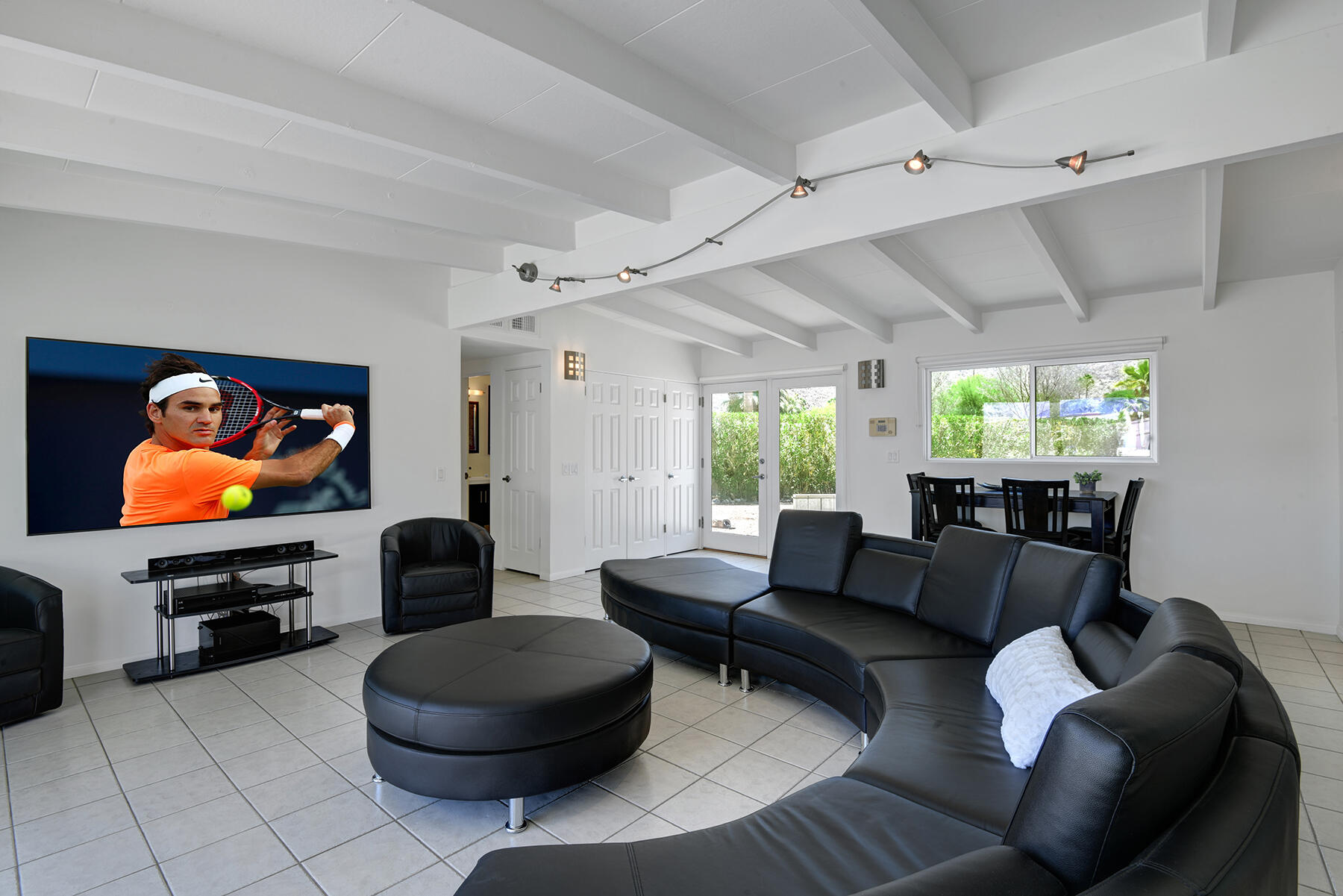 71704 Tunis Road Rancho Mirage, CA 92270 - Photo 7 of 47 a living room with furniture and a flat screen tv