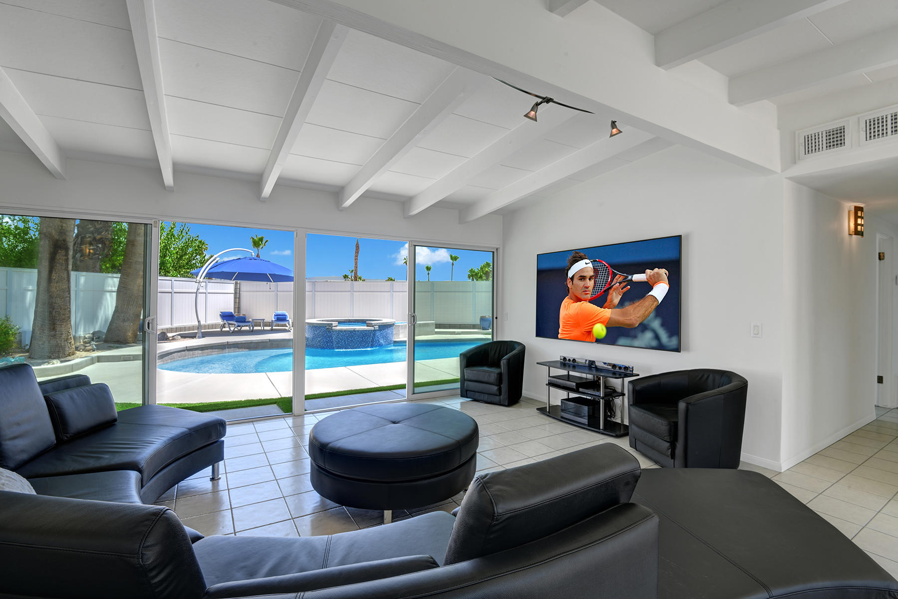 71704 Tunis Road Rancho Mirage, CA 92270 - Photo 10 of 47 a living room with furniture and a flat screen tv