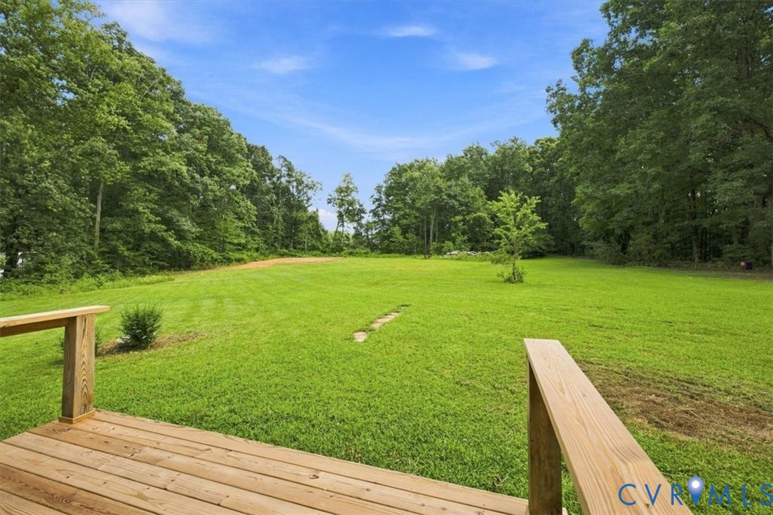 2338 George's Road Powhatan, VA 23139 - Photo 22 of 25 Expansive grassy lawn surrounded by mature trees,