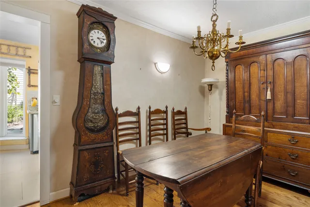 a view of a room with furniture and chandelier