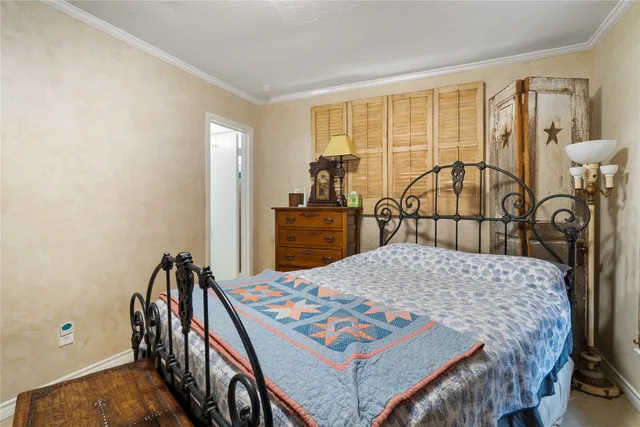 a bedroom with a bed and a table in it