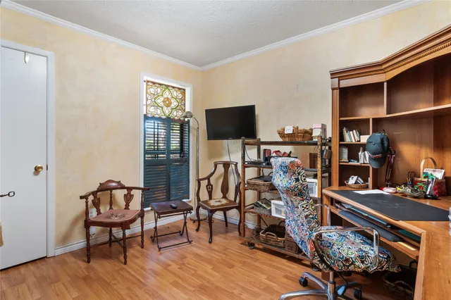 a living room with lots of furniture and a flat screen tv