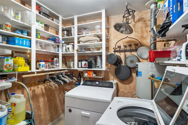 a utility room with multiple dryer and washer