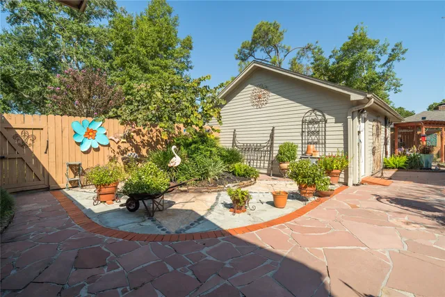 a view of a chairs and table in the patio