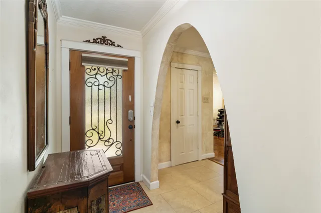 a view of an entryway with wooden floor