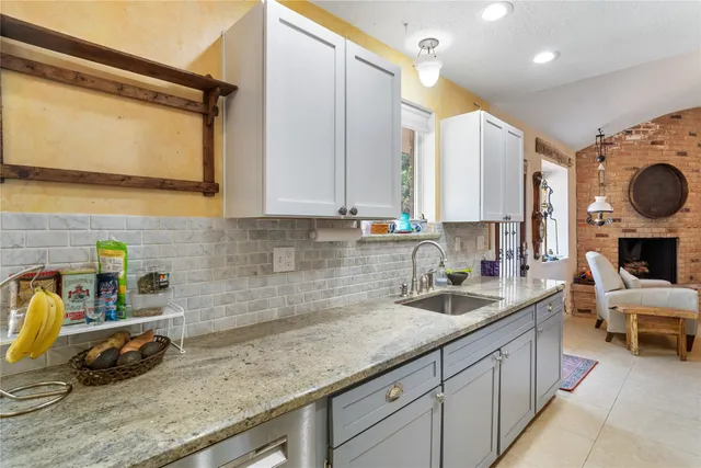 a kitchen with a sink and a cabinets