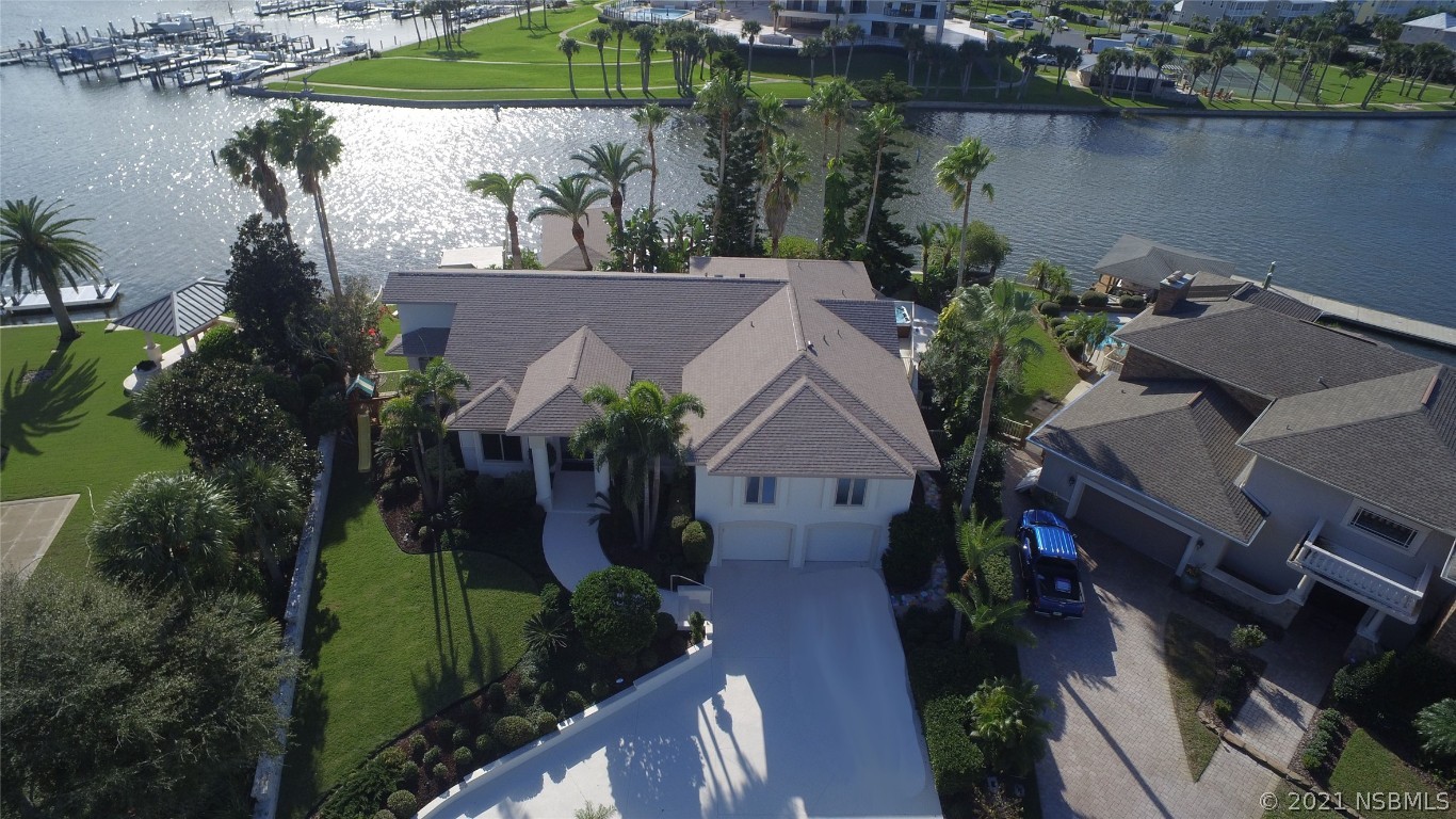 an aerial view of house with yard swimming pool and outdoor seating