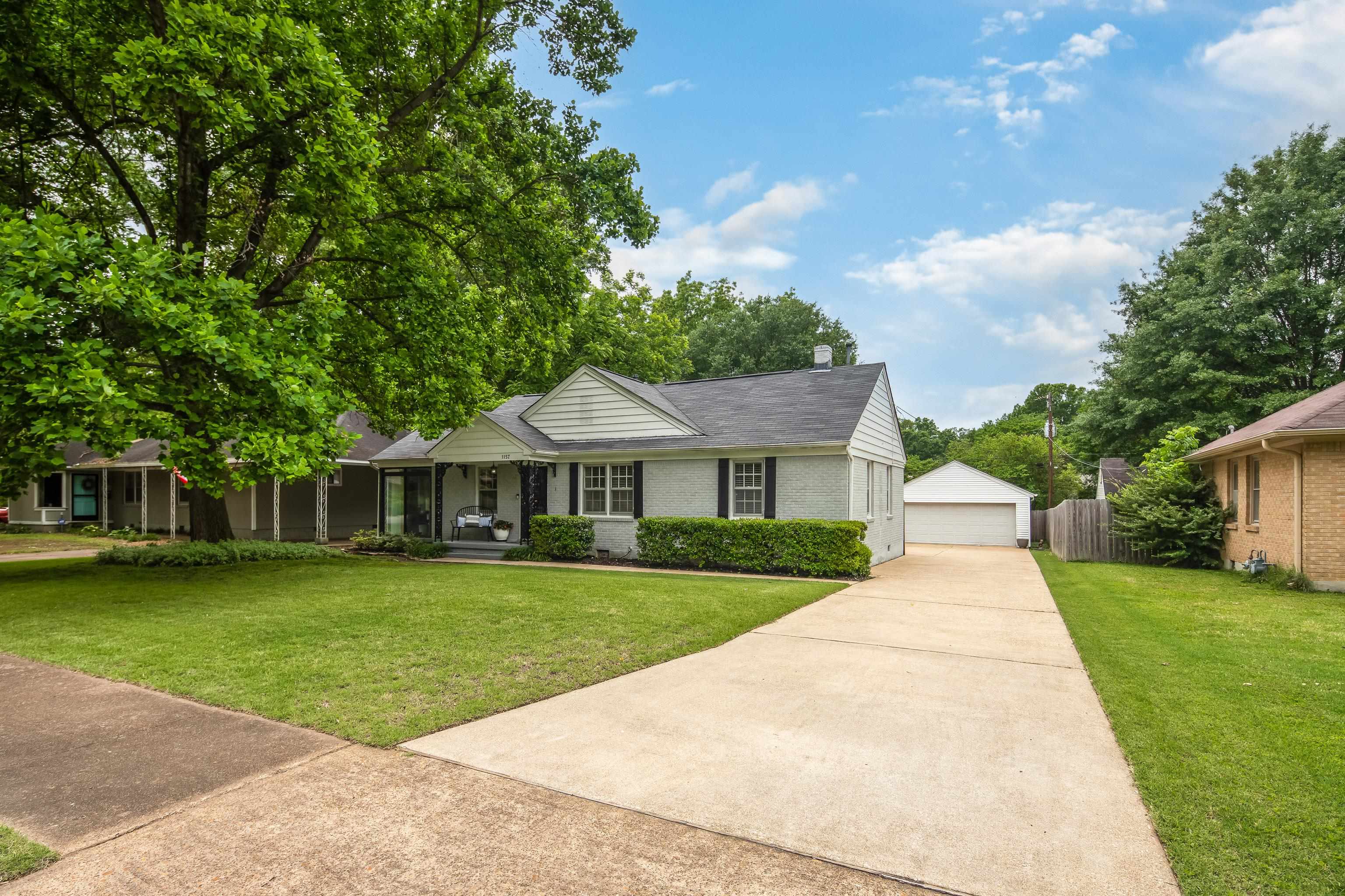1157 Colonial Road Memphis, TN 38117 - Photo 1 of 25 front view of a house with a yard