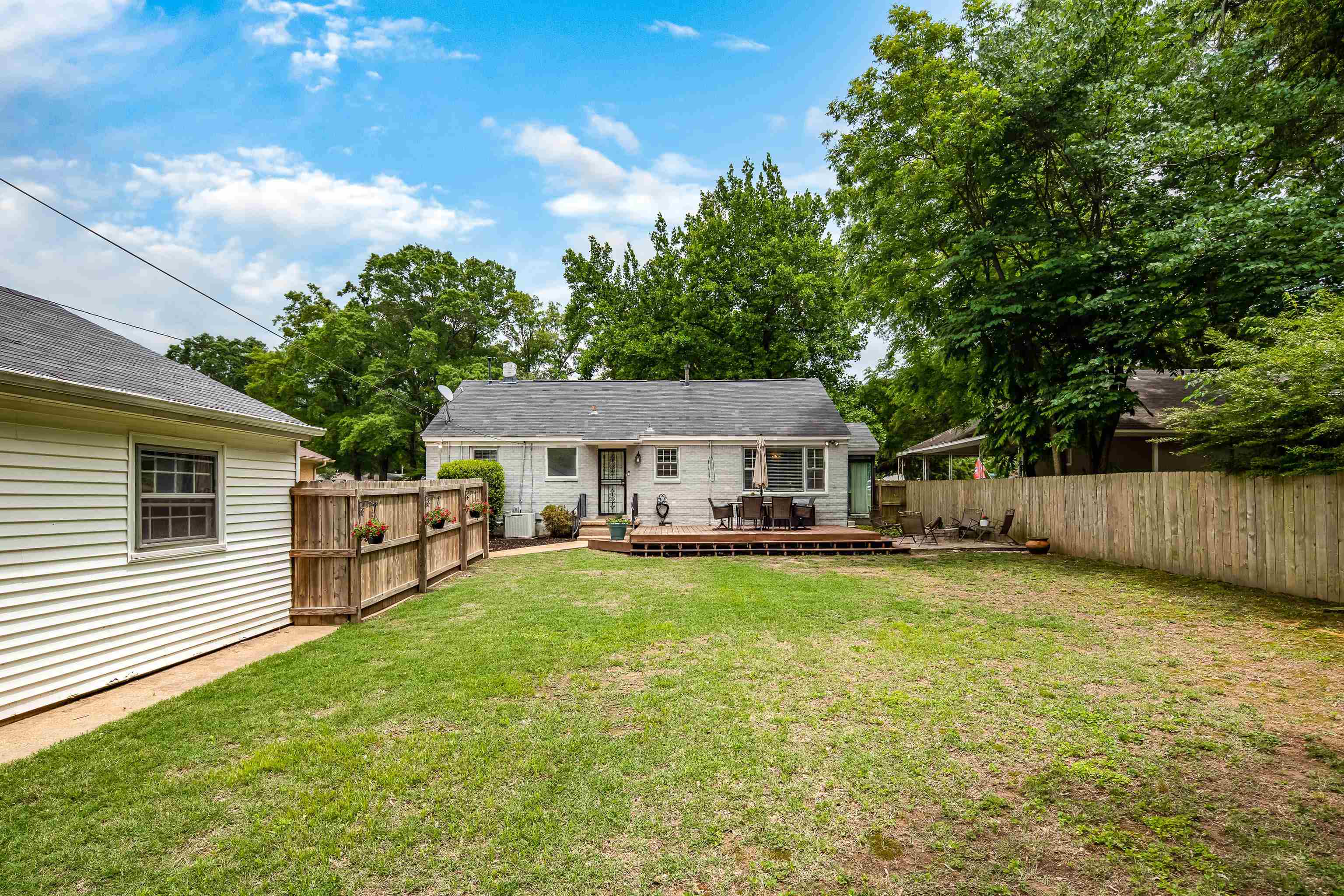 1157 Colonial Road Memphis, TN 38117 - Photo 20 of 25 a view of a house with a yard and sitting area