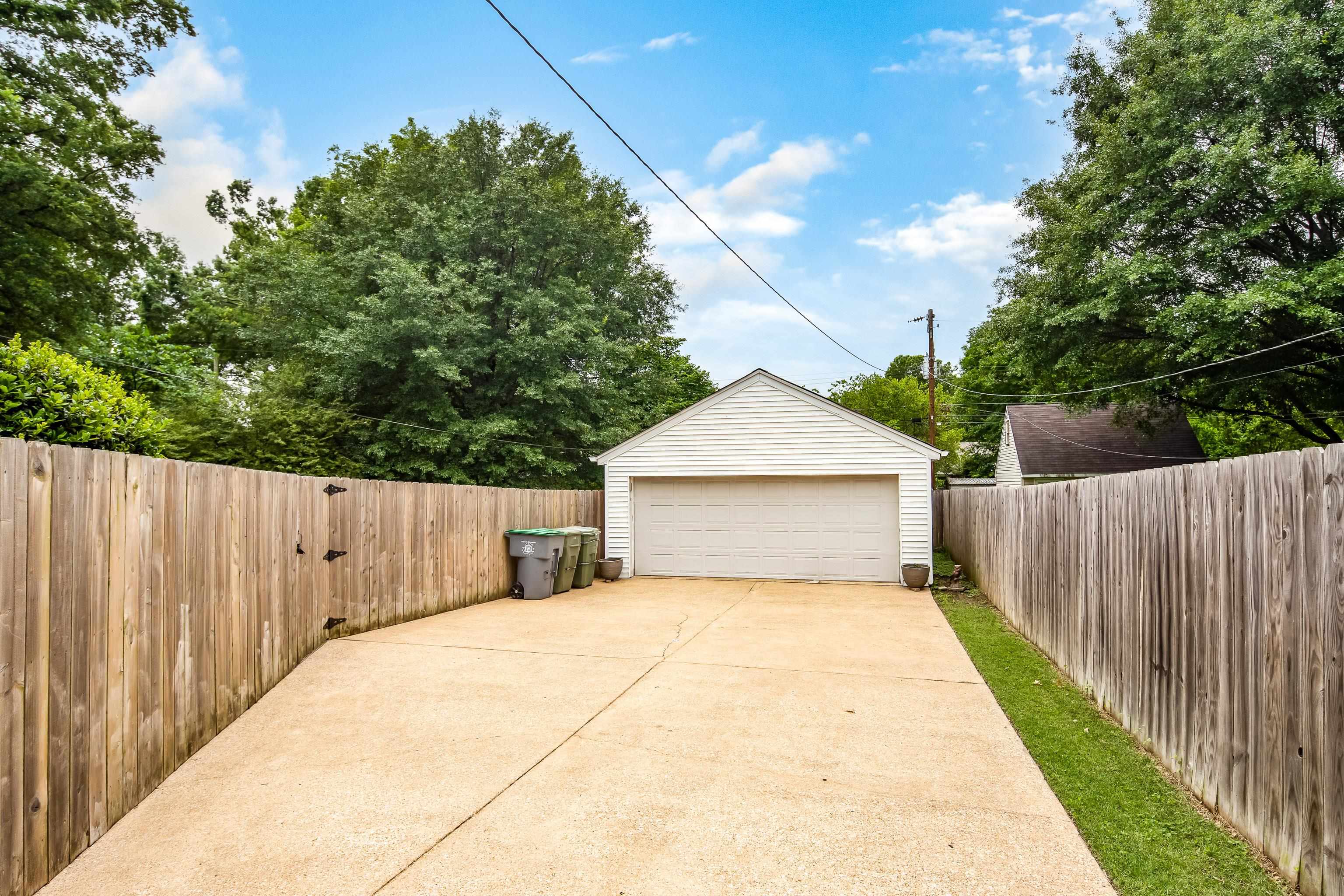 1157 Colonial Road Memphis, TN 38117 - Photo 21 of 25 a view of a house with wooden fence