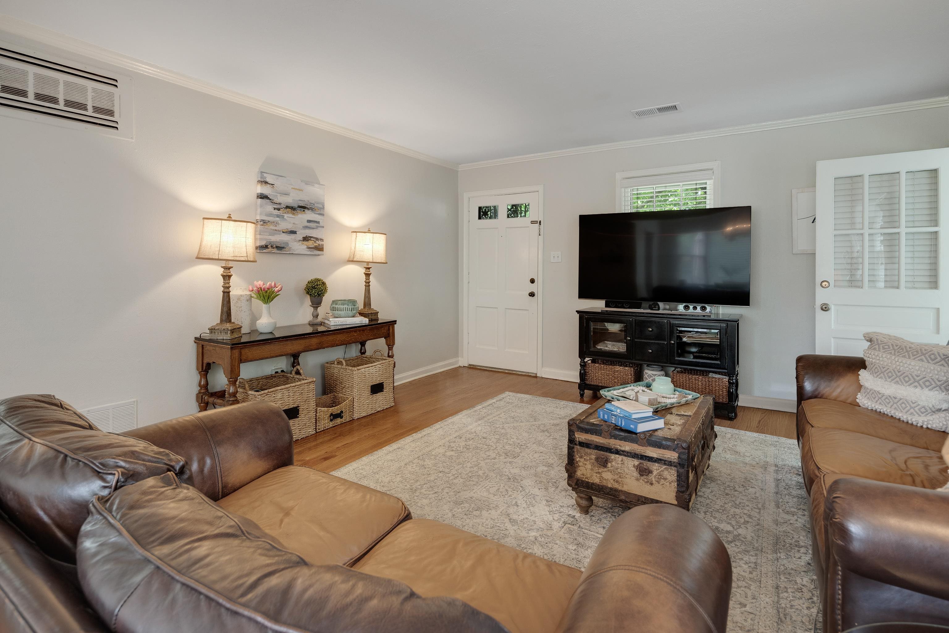 1157 Colonial Road Memphis, TN 38117 - Photo 3 of 25 a living room with furniture and a flat screen tv
