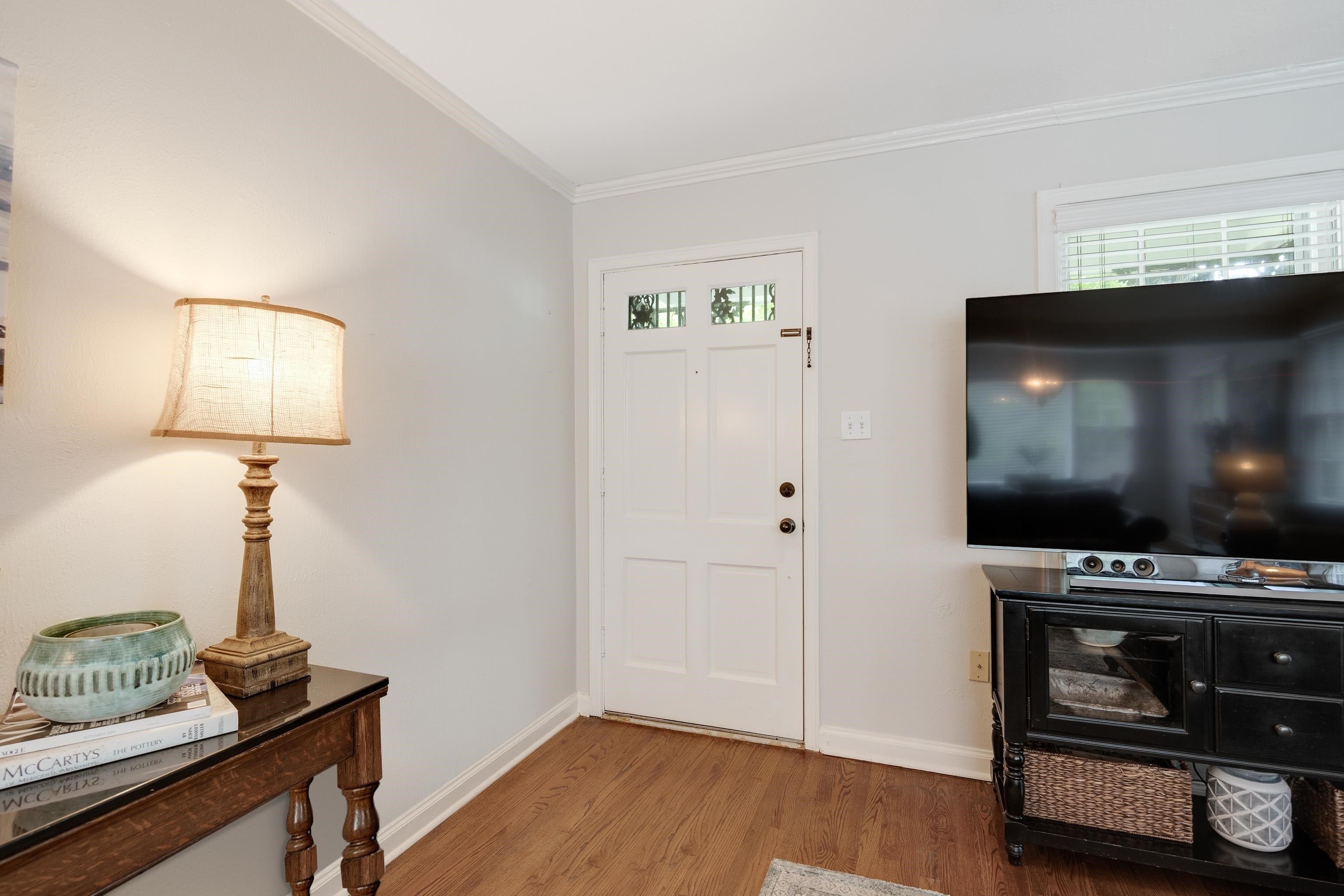 1157 Colonial Road Memphis, TN 38117 - Photo 4 of 25 a living room with furniture and a flat screen tv