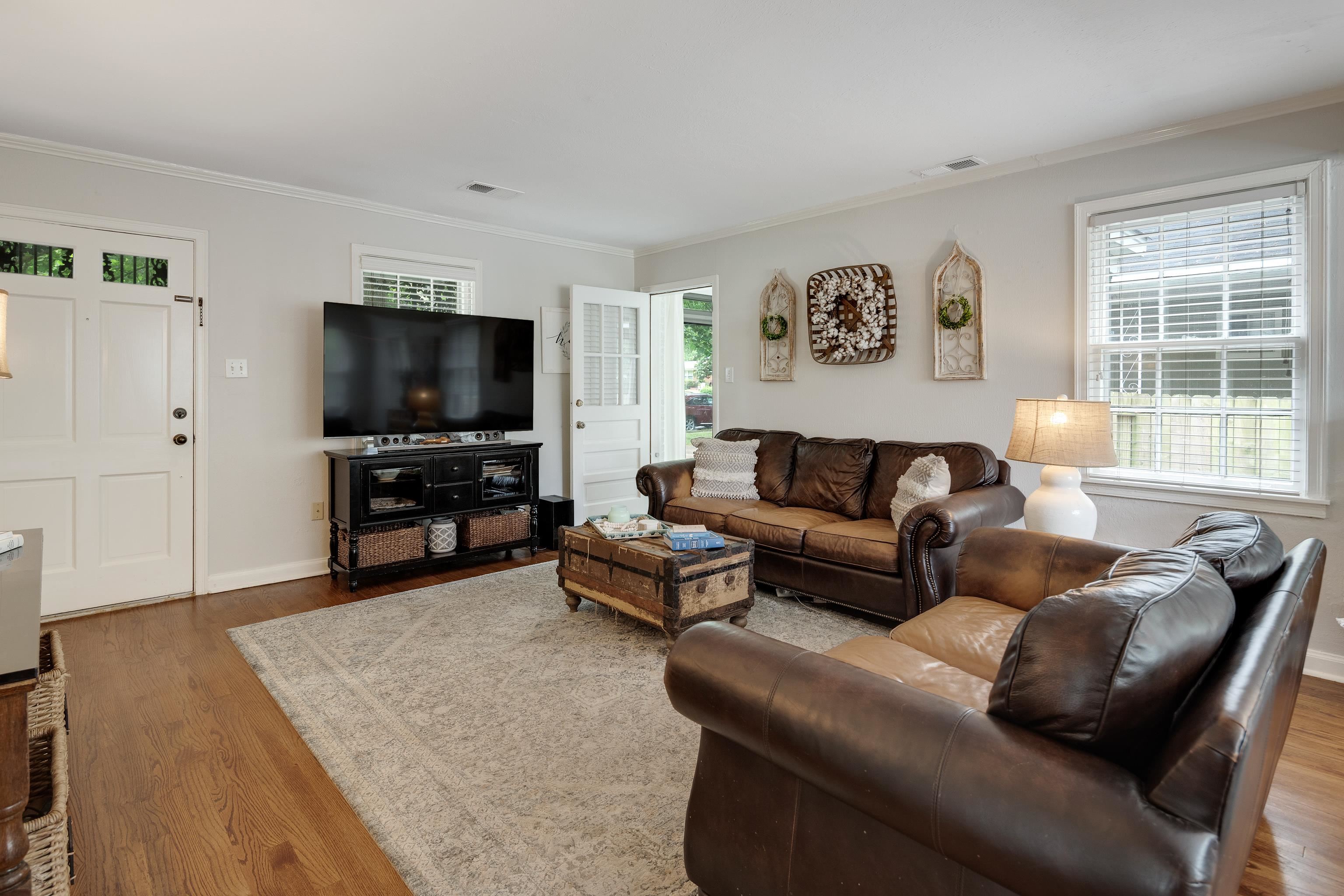 1157 Colonial Road Memphis, TN 38117 - Photo 5 of 25 a living room with furniture and a flat screen tv