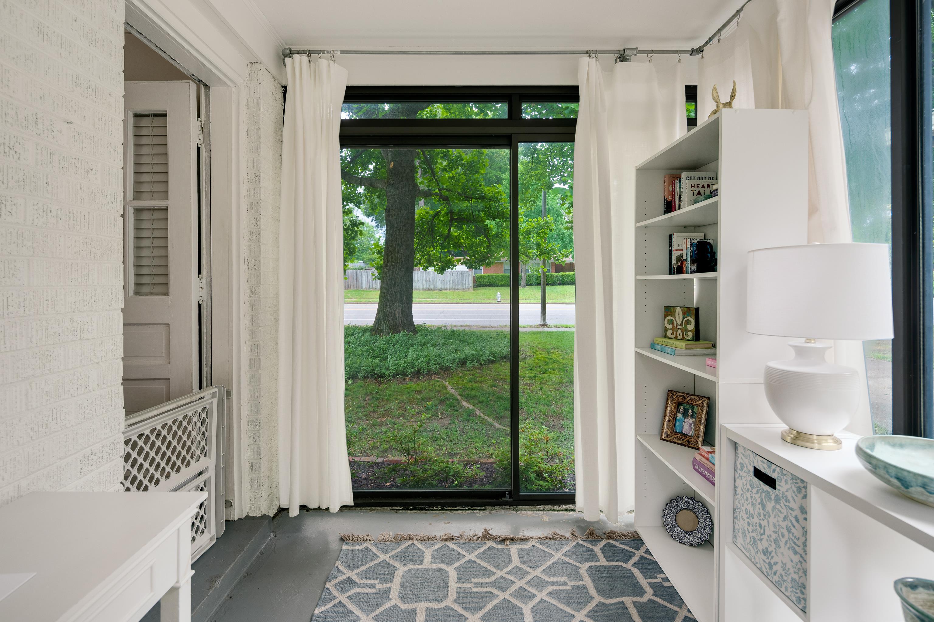 1157 Colonial Road Memphis, TN 38117 - Photo 7 of 25 a view of an entryway with wooden floor and windows