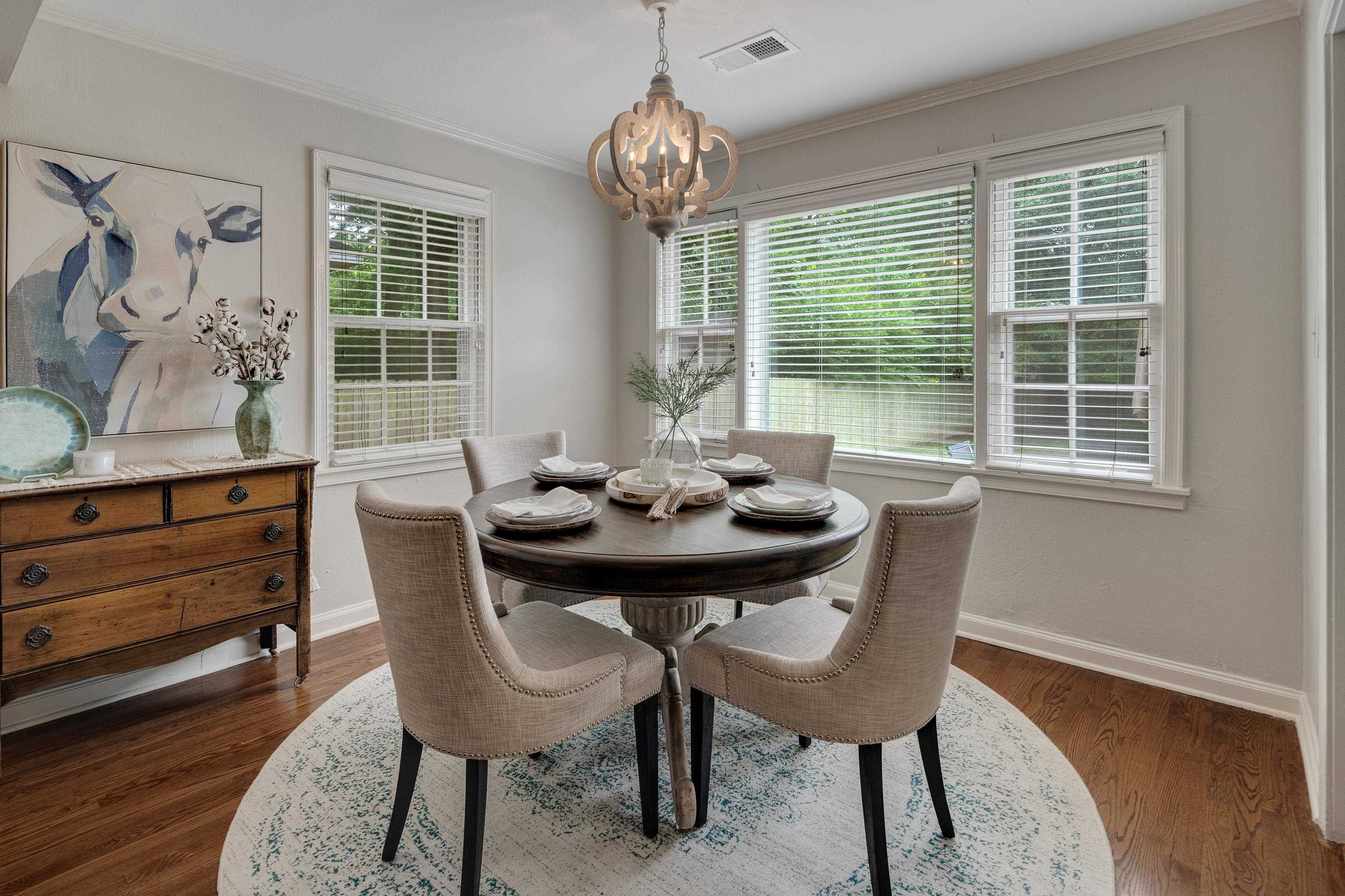 1157 Colonial Road Memphis, TN 38117 - Photo 8 of 25 a view of a dining room with furniture window and wooden floor