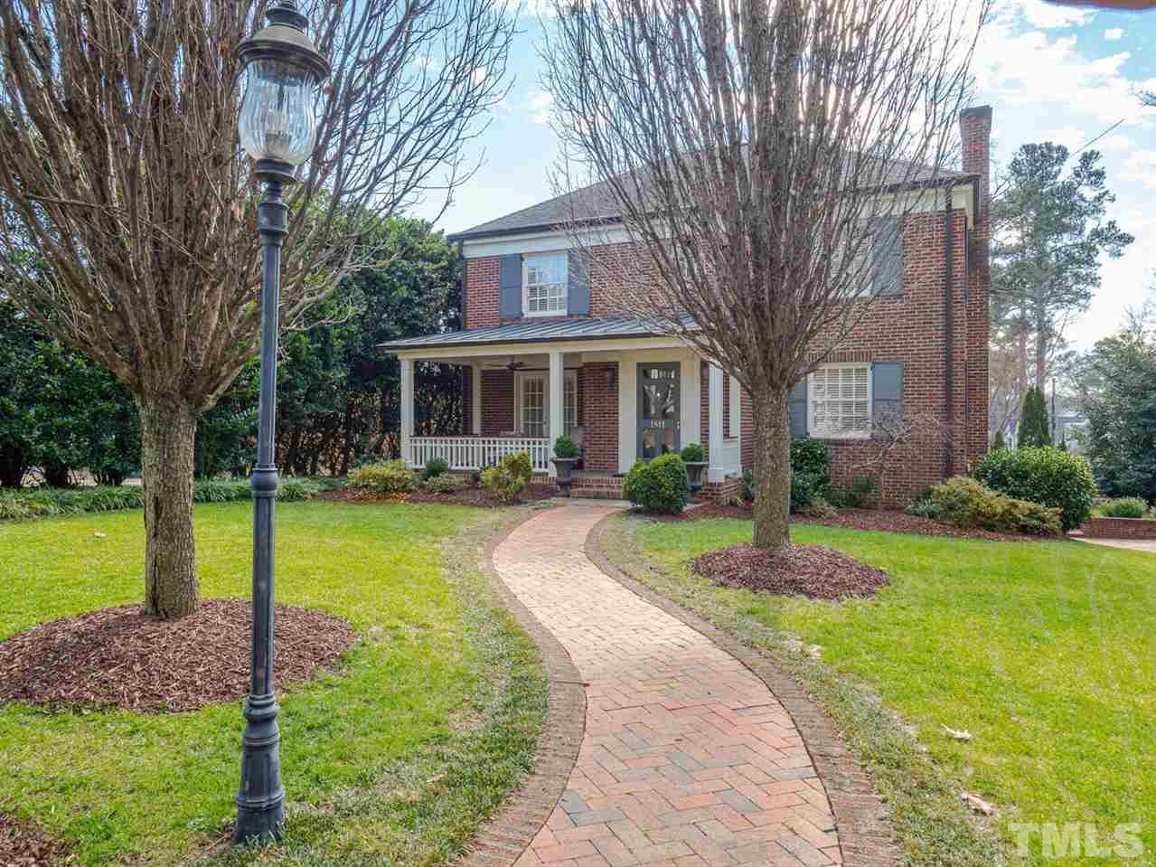 1811 Craig Street Raleigh, NC 27608 - Photo 1 of 28 a front view of a house with swimming pool having outdoor seating