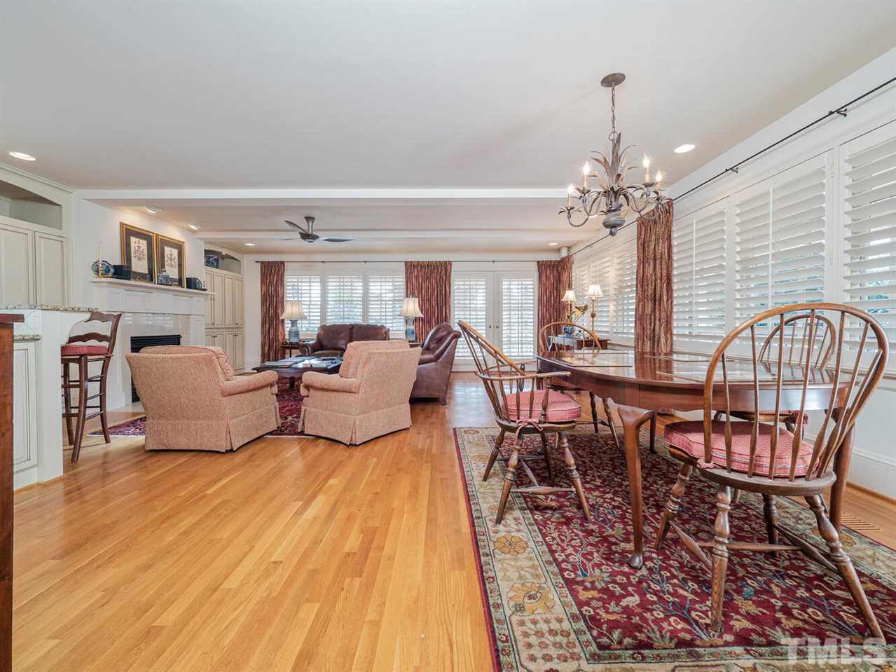 1811 Craig Street Raleigh, NC 27608 - Photo 12 of 28 a living room with furniture and a chandelier