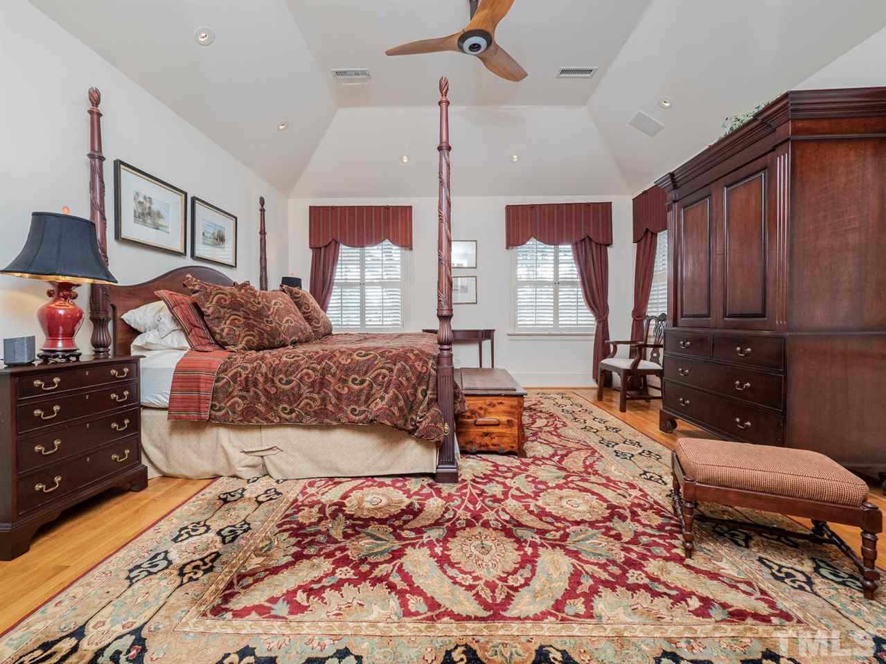 1811 Craig Street Raleigh, NC 27608 - Photo 13 of 28 a bedroom with a bed dresser and a window
