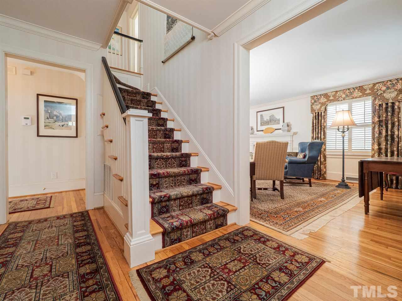 1811 Craig Street Raleigh, NC 27608 - Photo 3 of 28 a view of an entryway with wooden floor and a rug