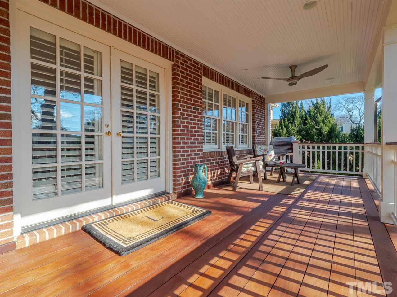 1811 Craig Street Raleigh, NC 27608 - Photo 24 of 28 a view of a patio with a dining table and chairs with wooden floor