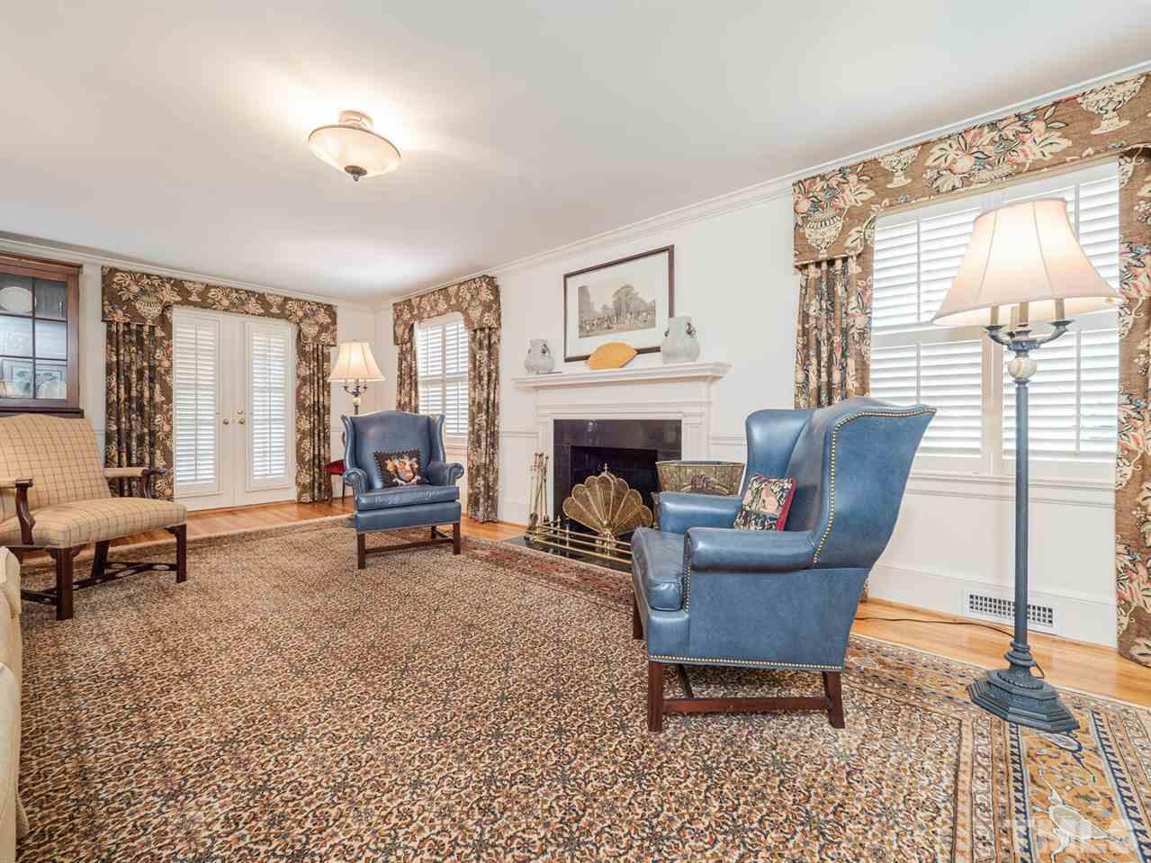 1811 Craig Street Raleigh, NC 27608 - Photo 4 of 28 a living room with furniture and a fireplace