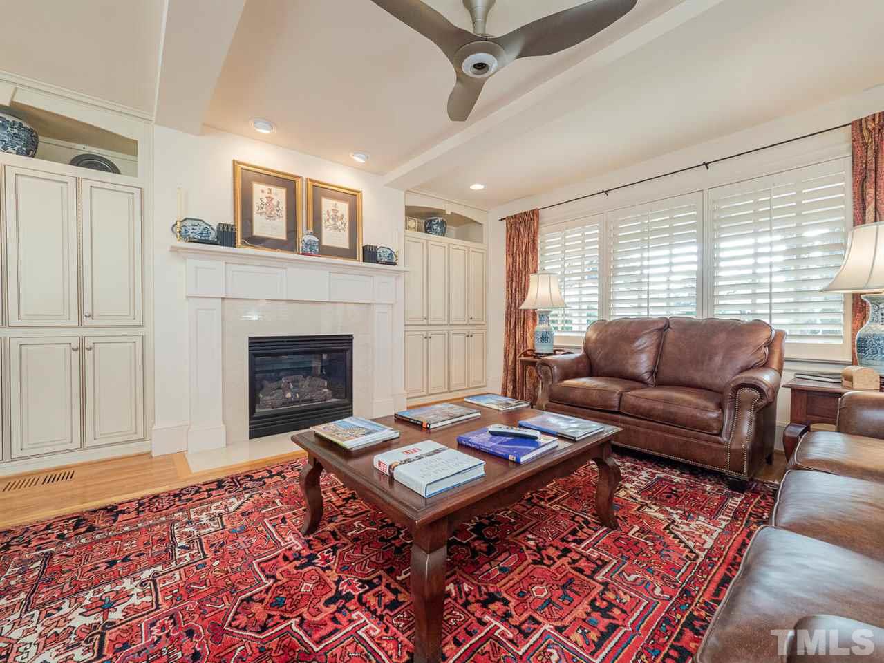 1811 Craig Street Raleigh, NC 27608 - Photo 10 of 28 a living room with furniture and a fireplace