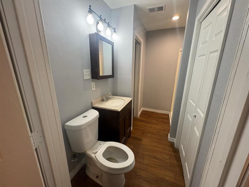 2998 County Road 658 Farmersville, TX 75442 - Photo 11 of 26 a bathroom with a sink and a mirror