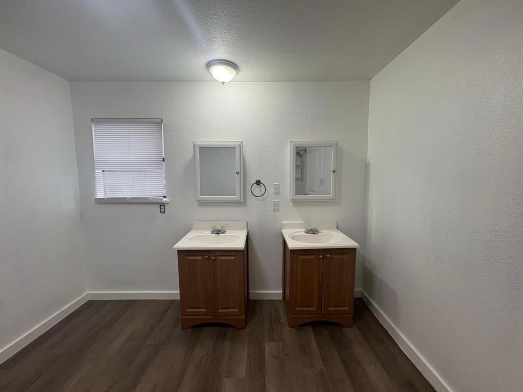 2998 County Road 658 Farmersville, TX 75442 - Photo 4 of 26 a room with a wooden floor and window