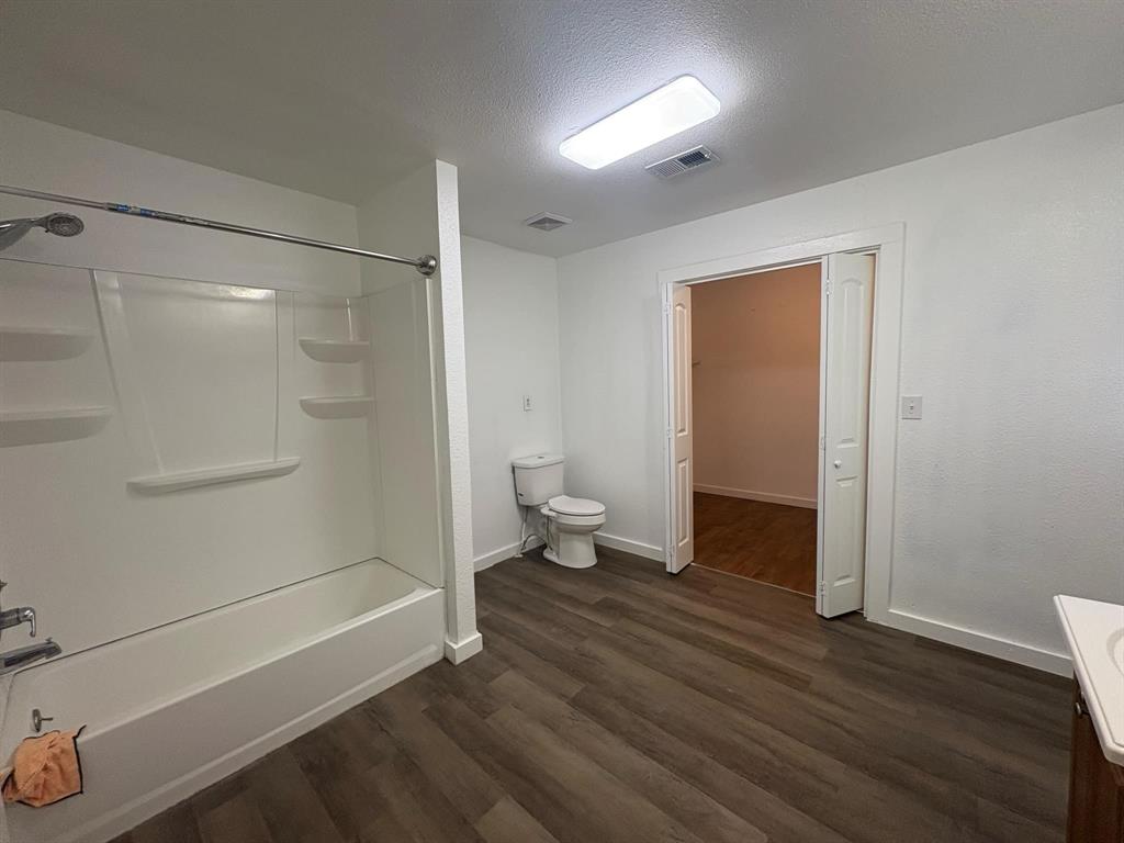 2998 County Road 658 Farmersville, TX 75442 - Photo 5 of 26 a bathroom with a shower and a toilet