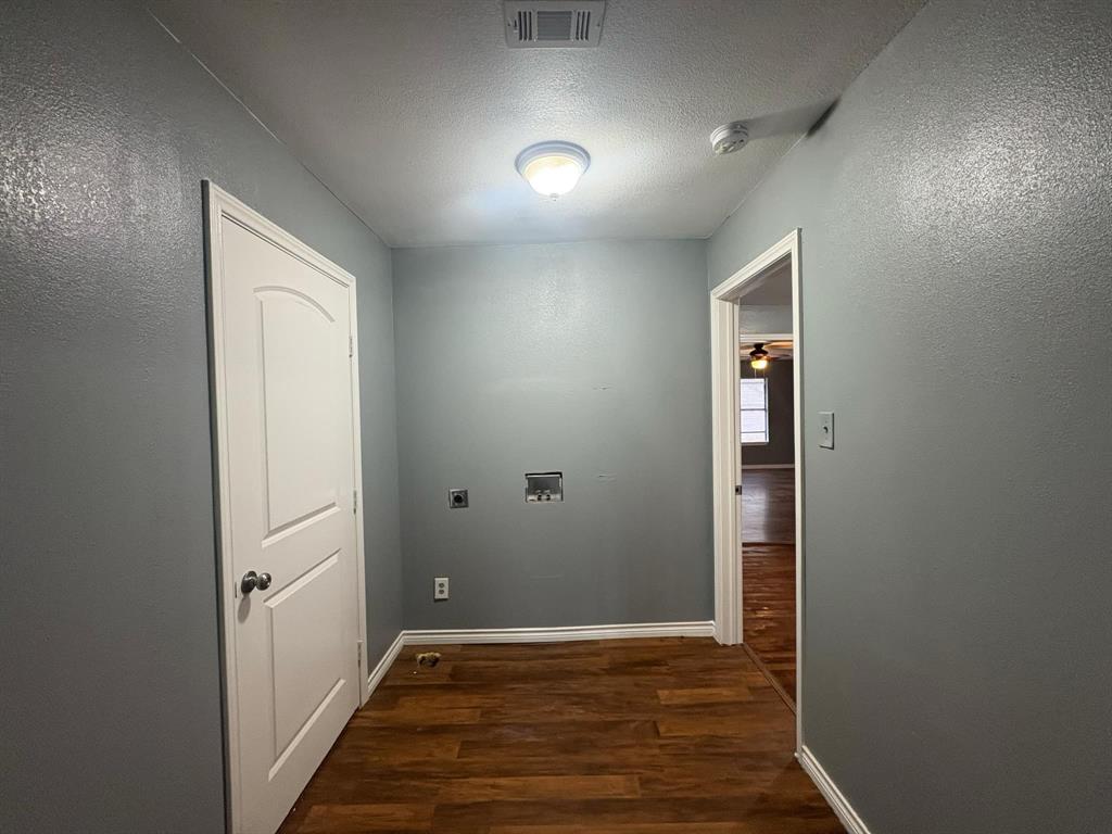 2998 County Road 658 Farmersville, TX 75442 - Photo 10 of 26 an empty room with wooden floor and closet