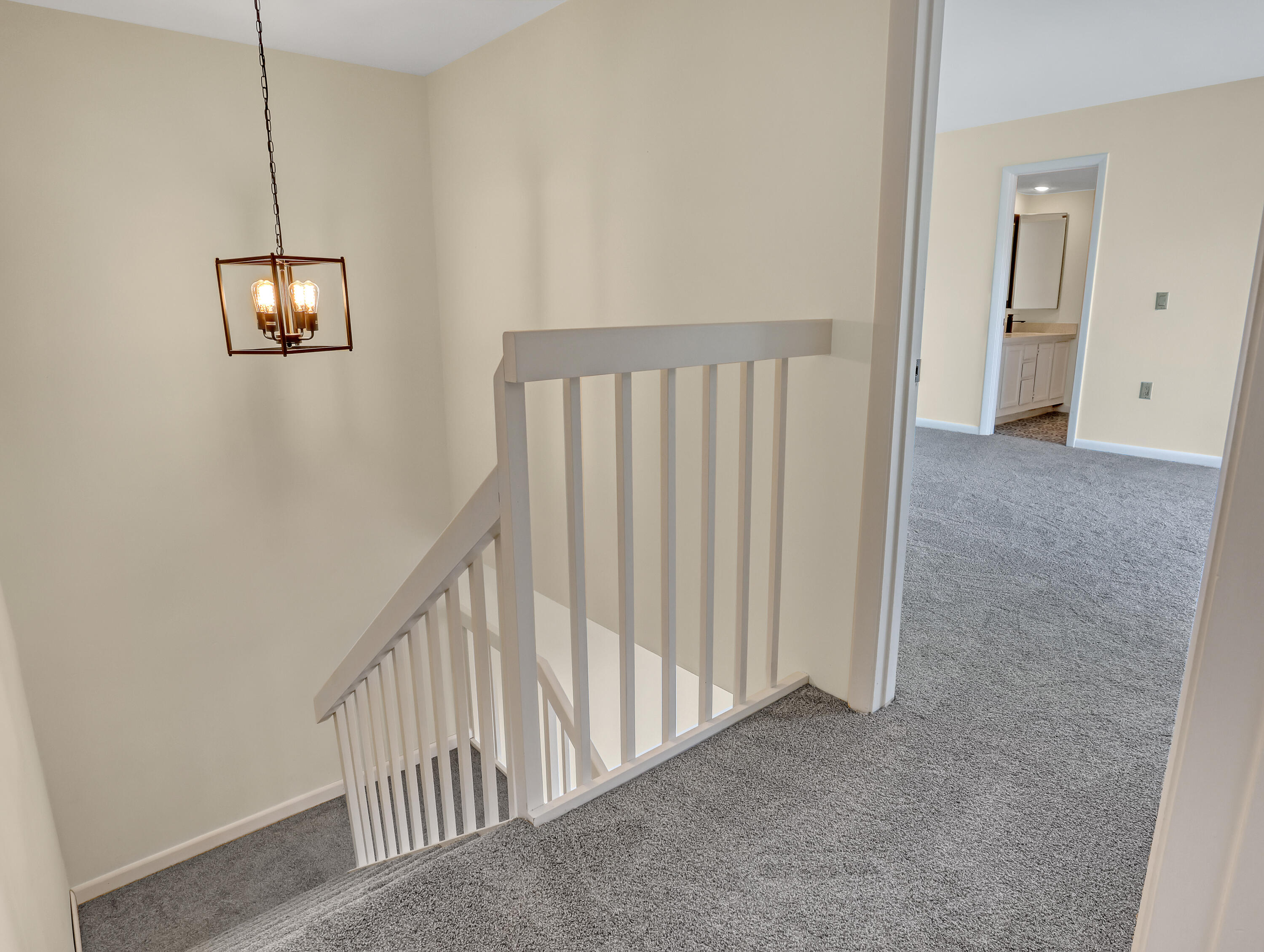5738 Southeast Windsong Lane, Unit 315 Stuart, FL 34997 - Photo 17 of 31 Staircase & Upstairs Landing